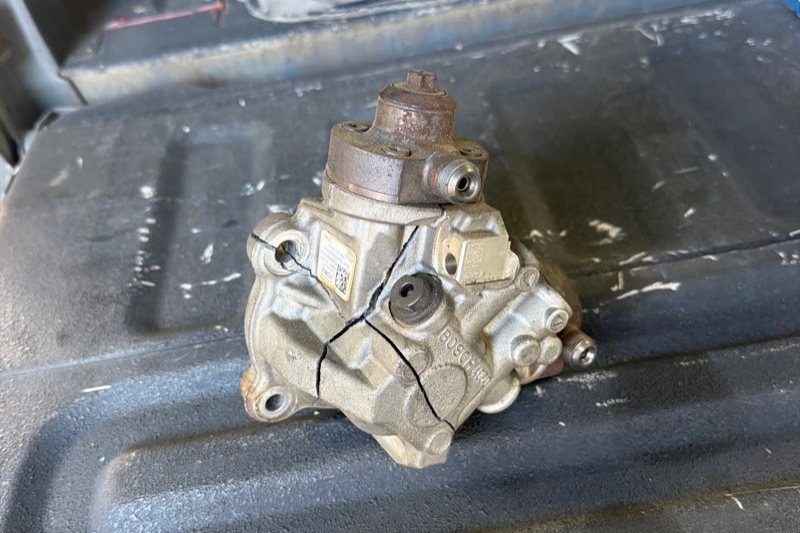 Failed Bosch CP4 high-pressure fuel pump with its housing cracked through.